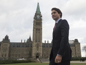 Prime Minister-designate Justin Trudeau walks to a news conference from Parliament Hill in Ottawa, Tuesday, Oct. 20, 2015.