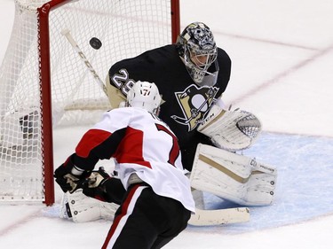 Pittsburgh Penguins goalie Marc-Andre Fleury (29) blocks a shot by Ottawa Senators' Kyle Turris (7) during the first period.