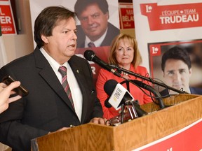 Liberal candidate for Ottawa-Vanier Mauril Bélanger speaks to the supporters after winning the election on the day of the federal election on Monday, Oct. 19, 2015. Ontario Attorney General Madeleine Meilleur looks on.