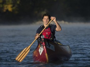 The Liberals set up engaging photo ops for their leader, like this one of Justin Trudeau paddling a canoe down the Bow River in Calgary on Sept, 17.