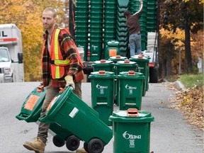 Green bins are delivered in Ottawa in 2009. The company that runs the green bin program refuses to accept leaf and yard waste.