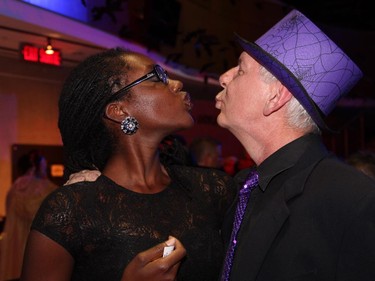 Malika Welsh, development and fundraising coordinator for the Ottawa School of Art, hams it up with Peter Honeywell, executive director of the Ottawa Arts Council,  at the Halloween-themed ARTinis, an annual benefit soirée for the AOE Arts Council, held at the Shenkman Arts  Centre on Thursday, October 29, 2015.