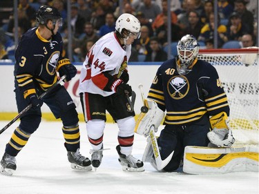 Buffalo Sabres defenseman Mark Pysyk (3) and Ottawa Senators center Jean-Gabriel Pageau (44) watch the blocker save from Sabres goaltender Robin Lehner (40) during the second period.