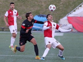 Mauro Eustaquio (20) of the Ottawa Fury keeps his eyes on the ball in front of Giuseppe Gentile of the San Antonio Scorpions at TD Place Sunday, Oct. 18, 2015.