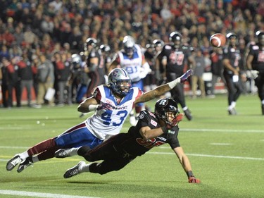 Montreal Alouettes' Terry Johnson breaks (43) up a pass to Ottawa Redblacks' Greg Ellingson during first half CFL action.