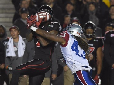 Montreal Alouettes' Terry Johnson breaks up a pass to Ottawa Redblacks' Maurice Price (7) during first half CFL action.