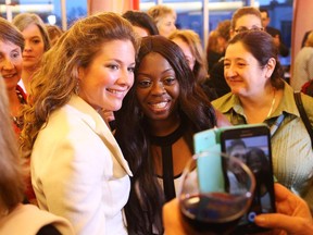 Sophie Gregoire-Trudeau, left, poses for a photo with Antoinette Hunte-Jacob at the Harvest Moon Extravaganza at the Wabano Centre for Aboriginal Health, October 27, 2015.  The crowd was very happy to share brief moments with her.