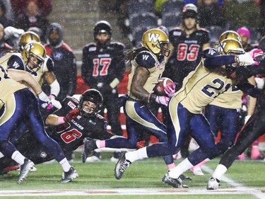 Nick Rosamonda  (36) of the Ottawa Redblacks can't tackle Troy Stoudermire of the Winnipeg Blue Bombers during first half CFL action.