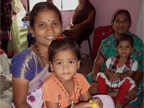 A mother and daughter are seen in Jagruti Seva Sanstha's daycare program.
