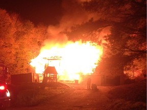 A home at 32 Juniper Rd. in Chelsea burns on Saturday, Oct. 10, 2015.