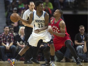 Minnesota Timberwolves forward Andrew Wiggins drives to the net past Toronto Raptors guard Norman Powell during second half NBA pre-season action Wednesday October 14, 2015 in Ottawa. The Timberwolves defeated the Raptors 89-87 .