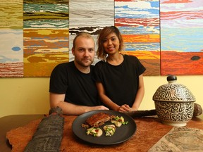 Oliver Truesdale-jutras, young chef, and his partner/chef Phoebe, with lamb dish and Moroccan curios representing their travels.