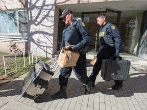 OPP investigators remove evidence from an apartment they were searching at 225 Lisgar St in Ottawa.