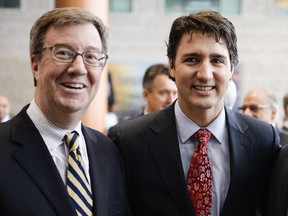 Files: Guest speaker at Mayor's breakfast series, Justin Trudeau (right) poses for a photo with Mayor Jim Watson (left) at City Hall on Thursday, Feb. 27, 2014.