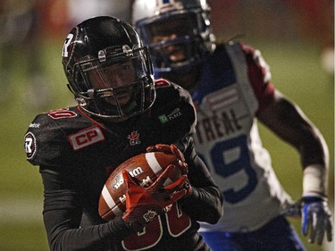 Ottawa Redblacks' Chris Williams 80, makes a TD catch against Montreal Alouettes' Jerald Brown, 39, during the first half.