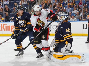 Robin Lehner #40 of the Buffalo Sabres makes a second period save against Jean-Gabriel Pageau #44 of the Ottawa Senators while being defended by Mark Pysyk #3.