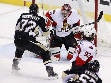 Pittsburgh Penguins' Patric Hornqvist (72) looks for a rebound off Ottawa Senators goalie Craig Anderson (41) on a shot by David Perron (57) during the first period.