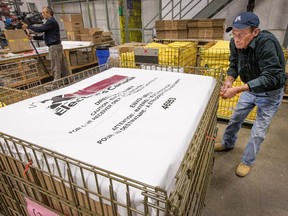 Phil Newton of Elections Canada prepared a cage filled with boxes containing all the materials needed to open a polling office for the 42nd general election. There are 77,000 ordinary polls on election day, 7, 000 advance polls and 2,500 mobile polls for hospitals and care facilities.