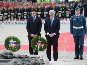 Justin Trudeau and Stephen Harper, attend a ceremonial service at the National War Memorial last year in Ottawa to commemorate the attack on Parliament Hill and the lives of Cpl. Nathan Cirillo and Warrant Officer Patrice Vincent.
