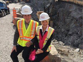 Rideau-Vanier Coun. Mathieu Fleury (left) and Ottawa Art Gallery director Alexandra Badzak sit on a large boulder at the future home of an expanded Ottawa Arts Gallery and redeveloped Arts Court. The city owns and operates Arts Court, a multi-disciplinary arts facility that currently houses 25 arts organizations, including the art gallery. The current project will see the gallery and Arts Court expand onto vacant, city-owned land at the corner of Daly Avenue and Waller Street.