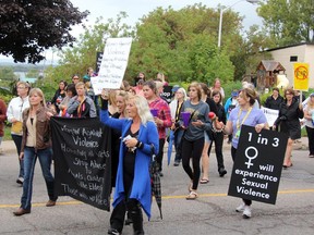Take Back the Night marchers rallied in front of the Pembroke Memorial Centre. The  march honoured the memories of three Renfrew County women killed near Wilno.