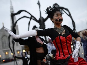 Stephanie, dressed up as a Victorian zombie, participates in Thrill the World in front of the National Gallery of Canada on Saturday, Oct. 24, 2015.