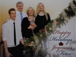Prime Minister Stephen Harper is pictured with his son Ben, wife Laureen, (holding Charlie the chinchilla) and daughter Rachel on their 2013 holiday card.