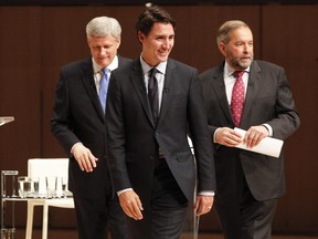 Liberal Leader Justin Trudeau, Conservative Leader Stephen Harper and NDP Leader Tom Mulcair leave the stage following the Munk Debate on Canada's foreign policy in Toronto, on Monday, Sept. 28, 2015.