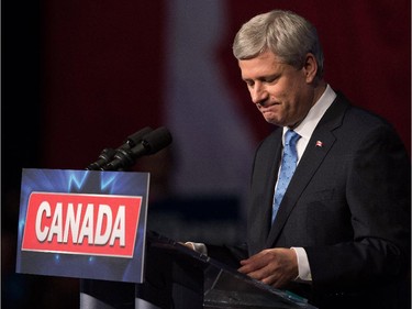 Conservative Leader Stephen Harper pauses while addressing supporters at an election night gathering in Calgary, Alta., on Monday October 19, 2015.