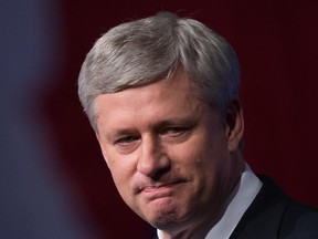 Conservative Leader Stephen Harper pauses while addressing supporters at an election night gathering in Calgary, Alta., on Monday October 19, 2015.