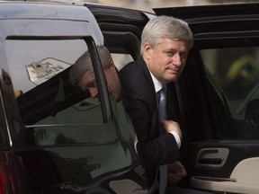 Outgoing prime minister Stephen Harper arrives at his Langevin Block office Wednesday.