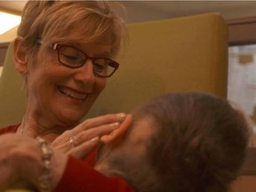 Still image from the six-part CBC series "Keeping Canada Alive, which examines the stories of 36 people across the country in Canada's health care system. This is Campbell, a disabled boy in respite care at Roger's House, with Roger's House manager Marion Rattray.