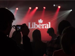 Supporters gather around the stage as they watch results being reported at Liberal party headquarters in Montreal on Monday, Oct. 19, 2015.