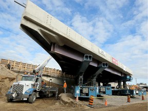 - the new east side of the bridge (seen here) will be lifted into place following demolition. Brace yourself. The Queensway will be closed this weekend as workers demolish the old Kent Street bridges and replace them with two new bridges (east and west side of the 417). Work continued Wednesday, October 21, 2015 in preparation for the massive weekend project. Closure starts Friday at 11p.m. and runs through to Sunday, October 25, 2015 at 11 p.m. (Julie Oliver / Ottawa Citizen)
