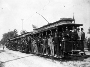 Thomas Ahearn, Mayor Thomas Birkett, city council members and other guests take the first street car to Ottawa's Exhibition Grounds, 1891.