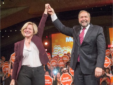 NDP Leader Tom Mulcair is introduced by  Alberta Premier Rachel Notley at a campaign rally in Edmonton on Friday, Oct. 16, 2015. Canadians will go to the polls in the 42nd federal election on Monday, October 19, 2015.