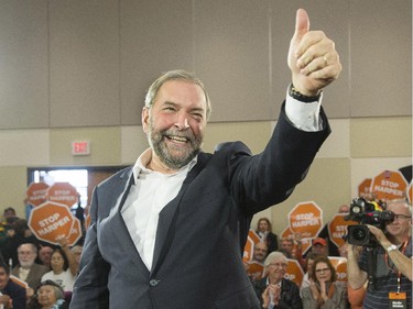 NDP Leader Tom Mulcair salutes supporters with a thumb's up at a campaign rally in Nanaimo, B.C., on Sunday, Oct. 11, 2015.