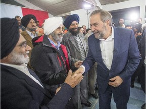 NDP Leader Tom Mulcair greets supporters at a town hall meeting Tuesday, October 6, 2015 in Surrey, B.C.