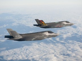 Two Lockheed Martin F-35B aircraft fly in formation at Naval Air Station Patuxent River, Md., in this file shot.