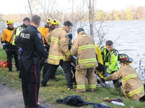 Emergency personnel help rescue an 83-year-old man who fell into the Ottawa River Saturday