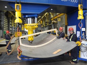 Workers at Seaspan Shipyards in Vancouver shape metal that will soon form part of the hull of the federal government's offshore fisheries science vessels.