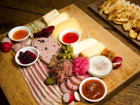 Chef Steve Mitton’s charcuterie board features many bites smoked or cured in-house, including duck breast that brings a visual interest to the board.