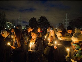 The Rideau River Residence Association (RRRA), a student association at Carleton University, held a candlelight vigil for Paris Saturday, Nov. 15, 2015 next to the French Embassy, at Rideau Falls Park in Ottawa.