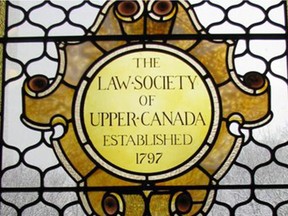 The Law Society of Upper Canada says Ottawa lawyer Ronald Houlahan never told it about criminal charges he is facing as he is required to do under law society bylaws.