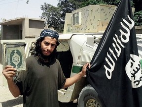 This undated image made available in the Islamic State's English-language magazine Dabiq, shows Abdelhamid Abaaoud. Abaaoud, the child of Moroccan immigrants who grew up in the Belgian capitalís Molenbeek-Saint-Jean neighborhood, was identified by French authorities on Monday Nov. 16, 2015, as the presumed mastermind of the terror attacks last Friday in Paris that killed over a hundred people and injured hundreds more. (Militant Photo via AP)