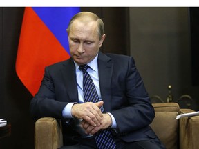 Russian President Vladimir Putin reacts during a meeting with Jordanian King Abdullah II (not pictured) at the Bocharov Ruchei state residence in Sochi on November 24, 2015. President Vladimir Putin on November 24 insisted that a Russian warplane shot down by a Turkish jet was flying over Syrian territory and did not pose any threat to Turkey.