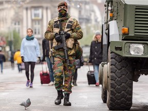 A Belgian Army soldier patrols on a main boulevard in Brussels, Sunday, Nov. 22, 2015. Western leaders stepped up the rhetoric against the Islamic State group on Sunday as residents of the Belgian capital awoke to largely empty streets and the city entered its second day under the highest threat level. With a menace of Paris-style attacks against Brussels and a missing suspect in the deadly Nov. 13 attacks in France last spotted crossing into Belgium, the city kept subways and underground trams closed for a second day.
