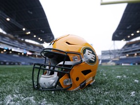 A helmet belonging to a Edmonton Eskimos player is seen on the field during a team practice session in Winnipeg on Wednesday, Nov. 25, 2015. The Eskimos will play the Ottawa Redblacks in the 103rd Grey Cup Sunday.