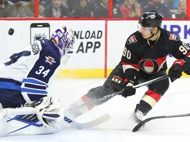 Alex Chiasson of the Ottawa Senators has his breakaway shot stopped by Michael Hutchinson of the Winnipeg Jets during first period NHL action.