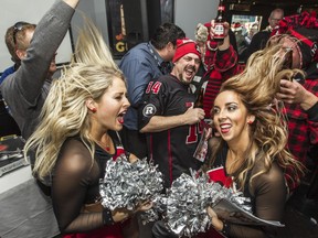 Although there was barely room to move at the Redblacks team party, cheerleaders Sylvie and Stephanie, along with fan Dale Ryan, found some room to dance.